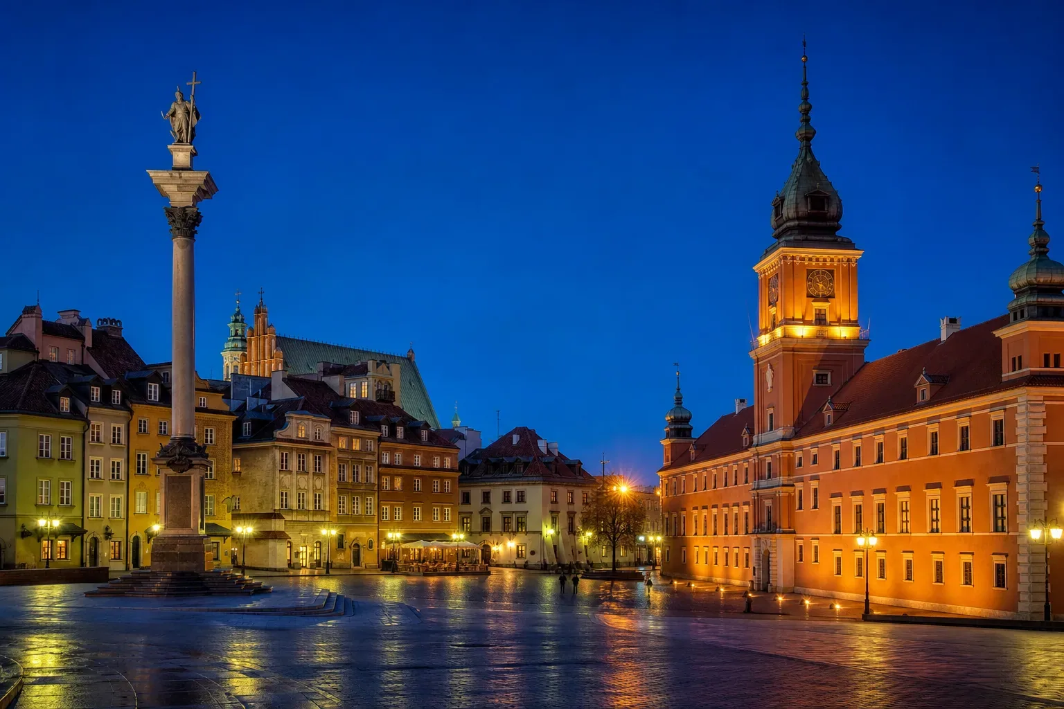 Castle Square in the Old Town of Warsaw at dusk, with the Royal Castle and Sigismund's Column